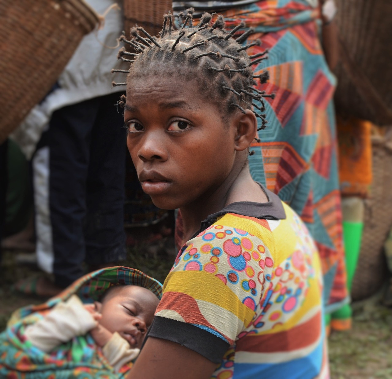 Young woman looking at the camera | equality for women in Congo