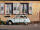 beetle car parked in front of old building | volunteering abroad