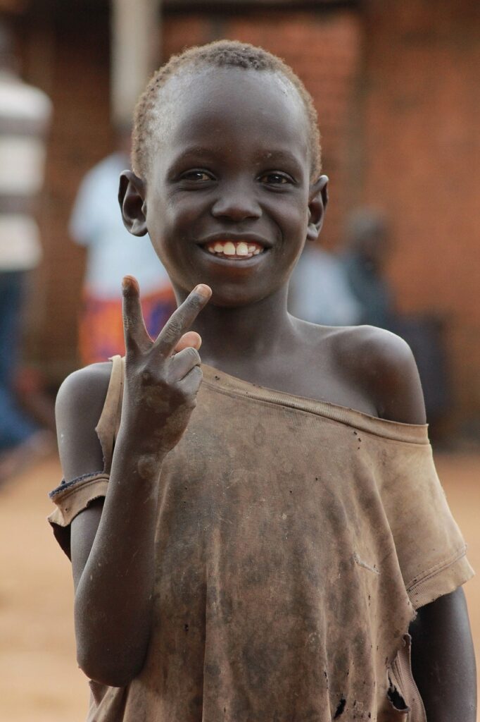 ugandan kid looking at the camera | Empowering Vulnerable Communities