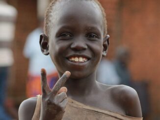 ugandan kid looking at the camera | Empowering Vulnerable Communities